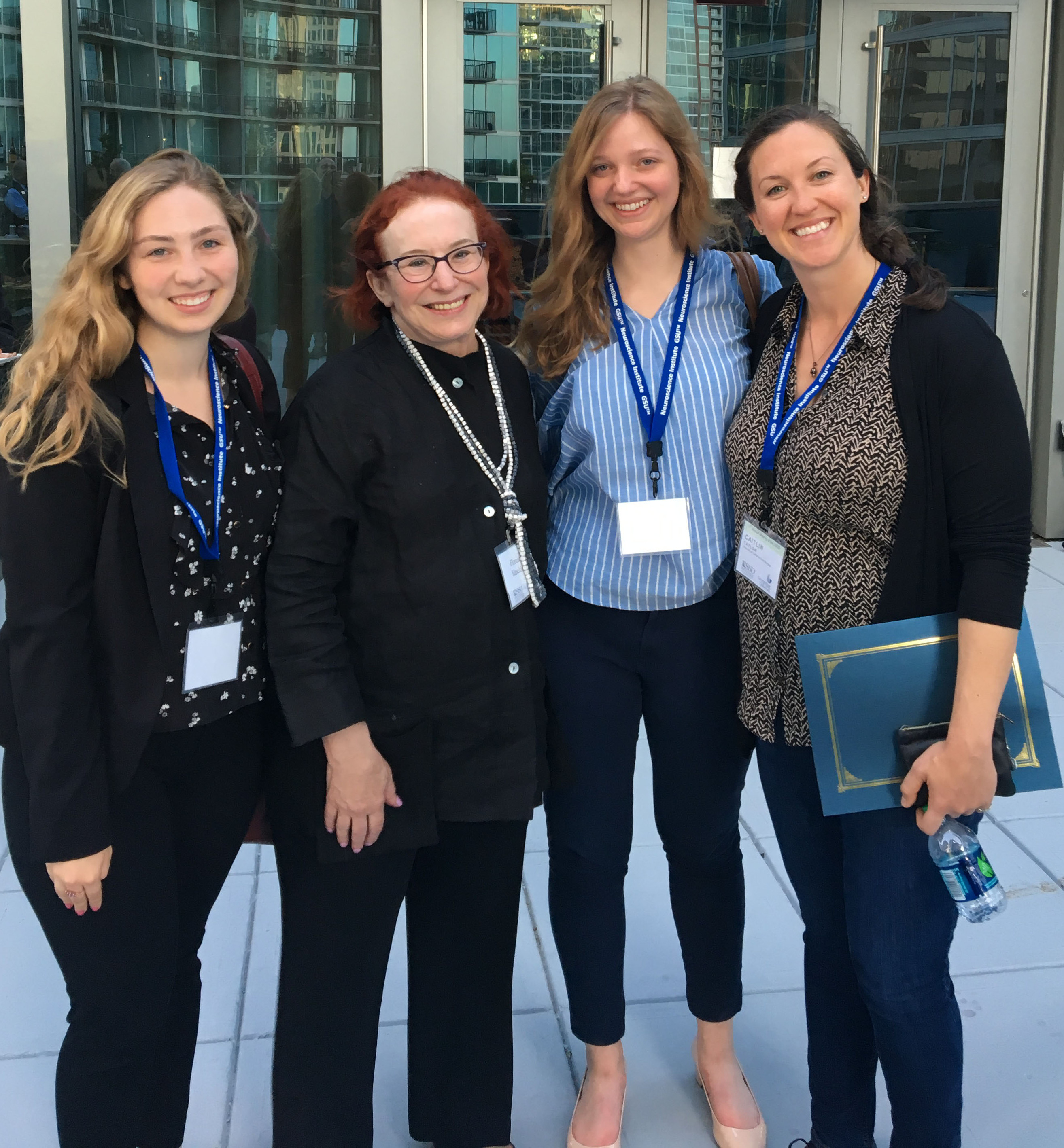Caitlin Taylor and three women after award ceremony